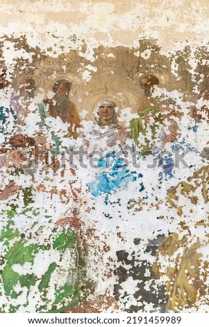 Frescoes on the wall of an abandoned Orthodox church, the church of the village of Spas-Penye, Kostroma region, Russia, June 2022. The year of construction is 1815. Currently abandoned.