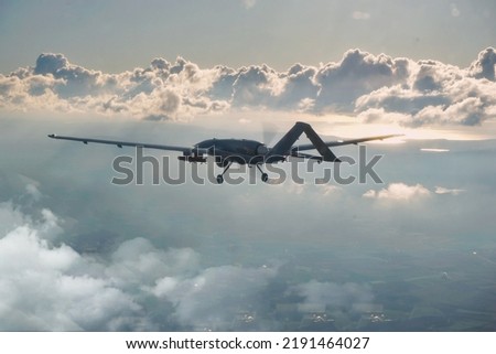 Bayraktar TB2, High-Altitude Long-Endurance, Unmanned Combat Aerial Vehicle. Bayraktar TB2 Unmanned aerial vehicle gliding through the clouds.  Royalty-Free Stock Photo #2191464027