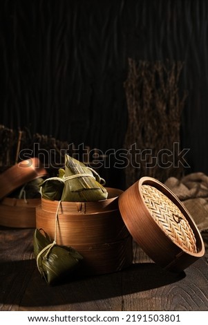 Bakcang bacang is preparation of glutinous rice wrapped in bamboo leaves, shaped into a diamond, filled with meat, and steamed Royalty-Free Stock Photo #2191503801