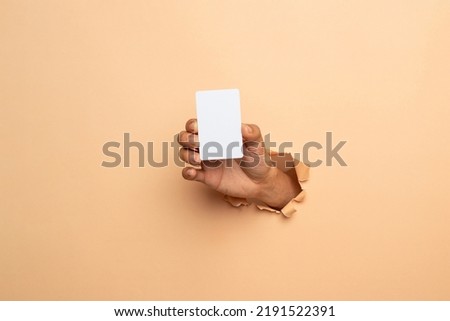 business man hand holding business card isolated on white background