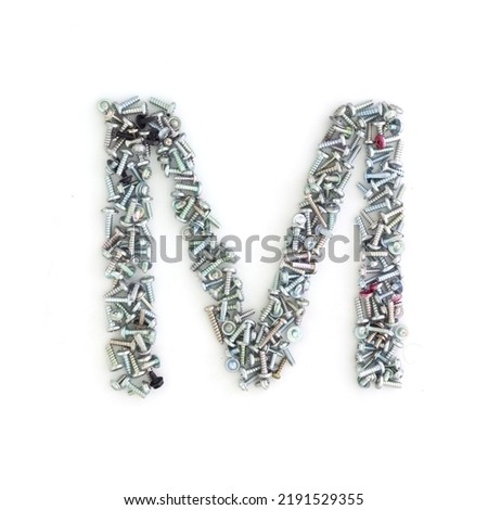 Capital letter M made from screws and bolts. Alphabet made from used screws. White background. Industrial bolt font