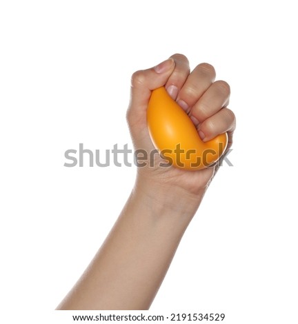 Woman squeezing antistress ball on white background, closeup Royalty-Free Stock Photo #2191534529