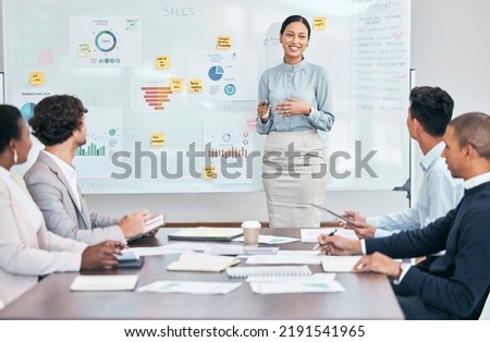 Presentation, workshop and training seminar with a young business woman talking to her team of colleagues during a boardroom meeting. Learning, teaching and coaching during an upskilling session Royalty-Free Stock Photo #2191541965