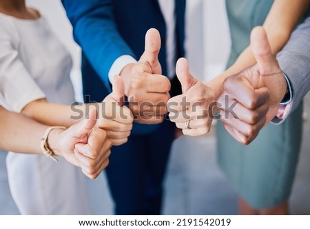 Closeup thumbs up, hand or sign for success, support or trust. Diverse group or team of business men, women or colleagues showing thumb as thank you or approval to idea plan, strategy or good news Royalty-Free Stock Photo #2191542019