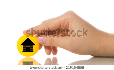 Hand touching yellow home icon isolated on white background. 