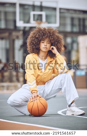 Basketball player on court, getting ready for game and looking serious before fitness exercise outside. Portrait of a black female sports person with an afro playing, training and exercising