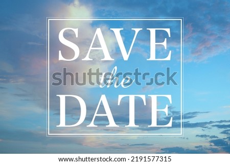 The letters SAVE the DATE written against the sky