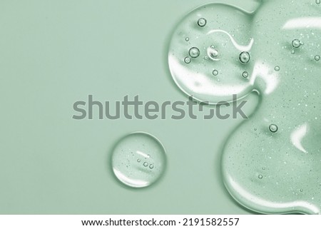 Close up Clear liquid cosmetic product. Gel texture with bubbles, skin care prodict Royalty-Free Stock Photo #2191582557