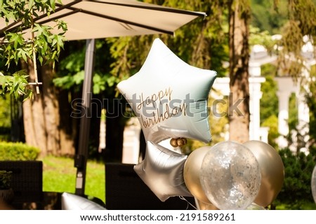 Decorations for celebrating the holiday. Birthday party outdoor. Balloons