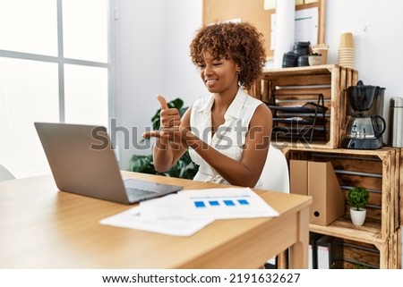 Young african american woman having video call using deaf language at office Royalty-Free Stock Photo #2191632627