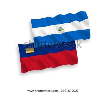 National vector fabric wave flags of Nicaragua and Liechtenstein isolated on white background. 1 to 2 proportion.