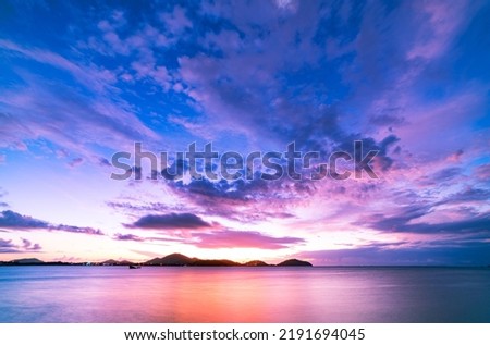 Landscape Long exposure of majestic clouds in the sky sunset or sunrise over sea with reflection in the tropical sea.Beautiful cloudscape scenery.Amazing light of nature Landscape nature background Royalty-Free Stock Photo #2191694045