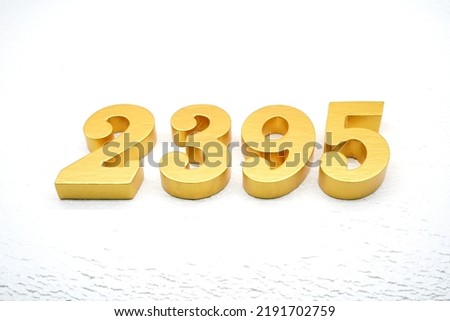   Number 2395 is made of gold painted teak, 1 cm thick, laid on a white painted aerated brick floor, visualized in 3D.                                