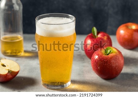 Boozy Refresing Cold Hard Apple Cider in a Pint Glass Royalty-Free Stock Photo #2191724399