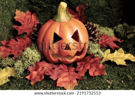 Dark and creepy carved pumpkin for Halloween or Samhain season