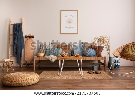 Sunny and bright space of living room with stylish sofa, pillows, coffee table, mock up poster frames, decorations, furnitures and personal accessories. Cozy home decor. Template. Summer vibe.	 Royalty-Free Stock Photo #2191737605