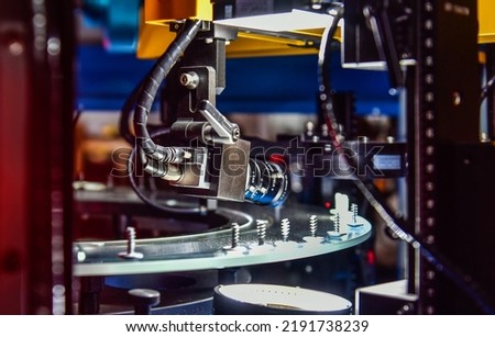 High-quality control in manufacturing optical sorting machine for fasteners nuts in product line Royalty-Free Stock Photo #2191738239