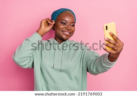 Photo of adorable cute girl take selfie wear street urban style clothes outfit isolated on pink color background