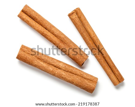 Cinnamon sticks on white background. Top view Royalty-Free Stock Photo #219178387