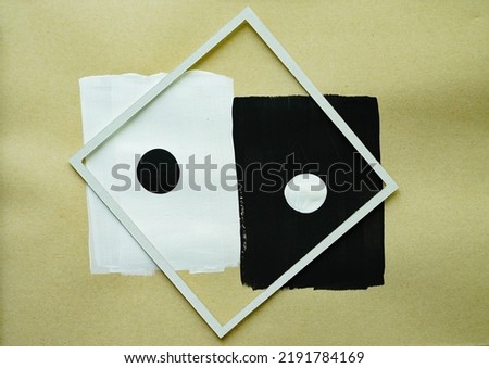Modern splash​ frame​ with​brown​ paper​ background, white and black painting on brown background. 