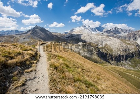 Hike between the Tovière and the Col de Fresse on an aerial path with a view of the Grande Motte which is a summit of the Vanoise massif located at the end of the Tignes valley, in Savoie.