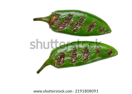 Grilled or fire roasted green jalapeno chili pepper isolated on white background. roasted green jalapeno peppers. Royalty-Free Stock Photo #2191808091