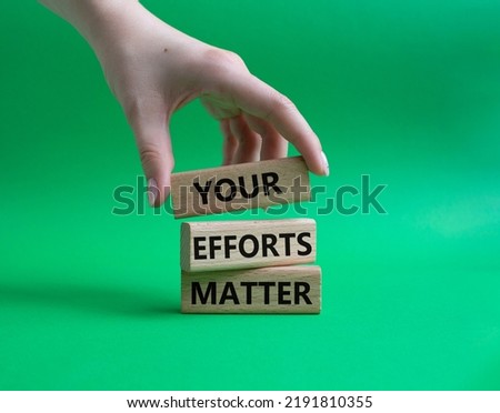 Your Efforts Matter symbol. Wooden blocks with words Your Efforts Matter. Beautiful green background. Businessman hand. Business and Your Efforts Matter concept. Copy space.