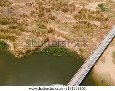 drone shot aerial view top angle bright sunny day river riverbed dried lake turquoise blue water tourism india tamilnadu white sand islands flood landscape wallpaper background grasslands 
