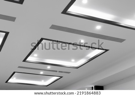 Office room ceiling with lighting. Ceiling with LED lamps in the office. interior decoration concept Royalty-Free Stock Photo #2191864883