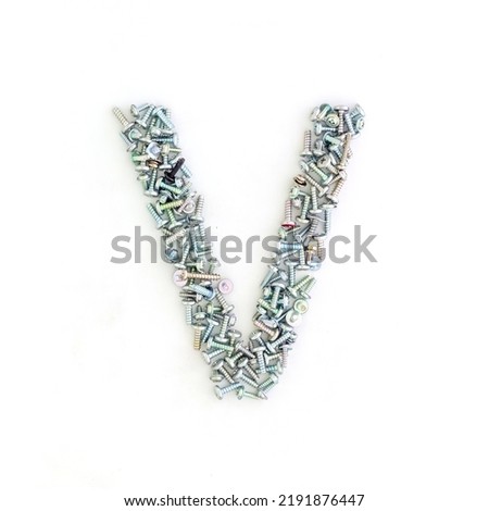 Capital letter V made from screws and bolts. Alphabet made from used screws. White background. Industrial bolt font
