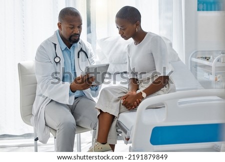 Doctor consulting patient with digital tablet, discussing diagnosis and medical checkup in hospital. Healthcare worker and trusted physician in appointment with medicine advice, wellness and Royalty-Free Stock Photo #2191879849