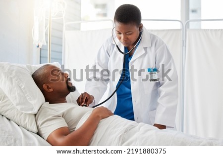 Medical doctor doing heart health checkup on patient in bed, listening for healthy heartbeat and consulting black man after surgery at hospital. Sick male person doing tests with healthcare worker Royalty-Free Stock Photo #2191880375