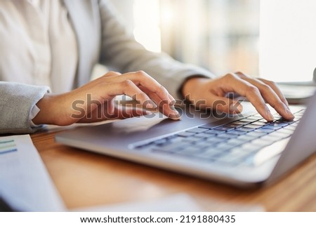 Keyboard, laptop and typing closeup of worker at desk in office. Business employee reading emails on computer in corporate company. Woman working with wireless digital technology to use the internet Royalty-Free Stock Photo #2191880435