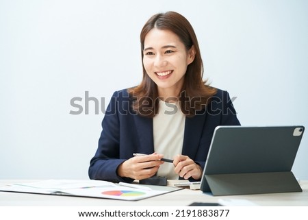 business woman giving a presentation in the office Royalty-Free Stock Photo #2191883877