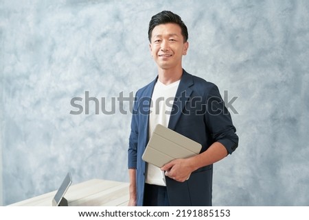 Businessman in office casual clothes at office Royalty-Free Stock Photo #2191885153