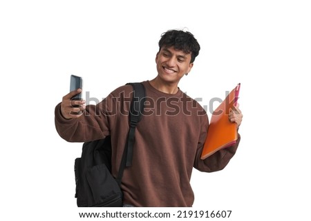 Young peruvian student taking a selfie with folders and backpack. Isolated over white background.