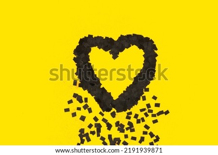 black heart melting on yellow background, art minimal design