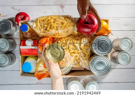 Help Collection Center, Free Food Distribution. Volunteering, food donation box grocery set for in-need people. Royalty-Free Stock Photo #2191942469
