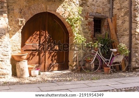 A yard in Piemonte with a bike and the flowers