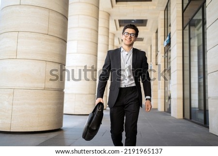 A manager with glasses, a man goes to work in a new office in formal clothes, career enhancement