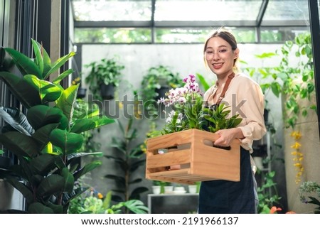 Beautiful cute female asian Gardeners are preparing small planters.Hobby of plant, gardening  at home.