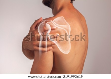 Scapula, man's shoulder pain, muscle and body anatomy. Human shoulder blade view from behind Royalty-Free Stock Photo #2191993619