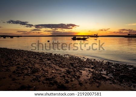 Fisherman boat during sunset. beautiful tropical vacation landscape. Royalty-Free Stock Photo #2192007581