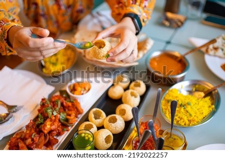 Indian food Curry butter chicken, Palak Paneer, Chiken Tikka, Biryani, Vegetable Curry, Papad, Dal, Palak Sabji, Jira Alu, Rice with Saffron on table. Royalty-Free Stock Photo #2192022257