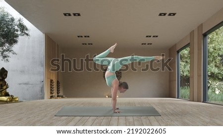 Young athletic attractive woman practicing yoga in a wooden yoga hall.