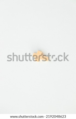 Christian cross on white background, top view with space for text. Religion concept
