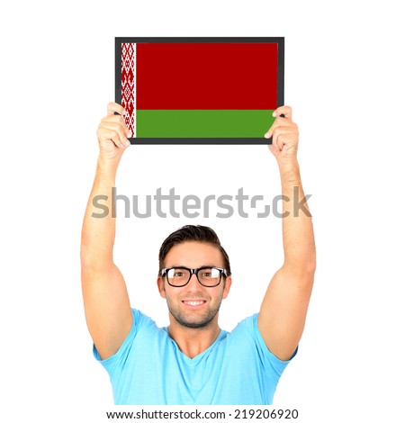 Portrait of a young casual man holding up board with National flag of Belarus