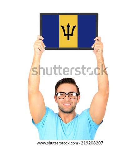 Portrait of a young casual man holding up board with National flag of Barbados