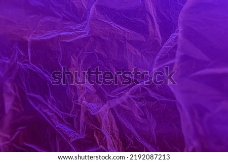 Polyethylene under neon. Plastic texture under ultraviolet light. High quality photo