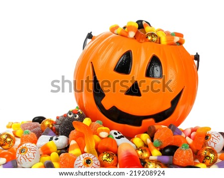 Halloween Jack o Lantern pail overflowing with candy